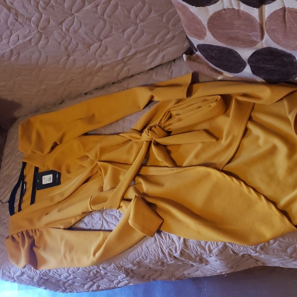 A yellow dress with a plunging neckline from fashion nova.